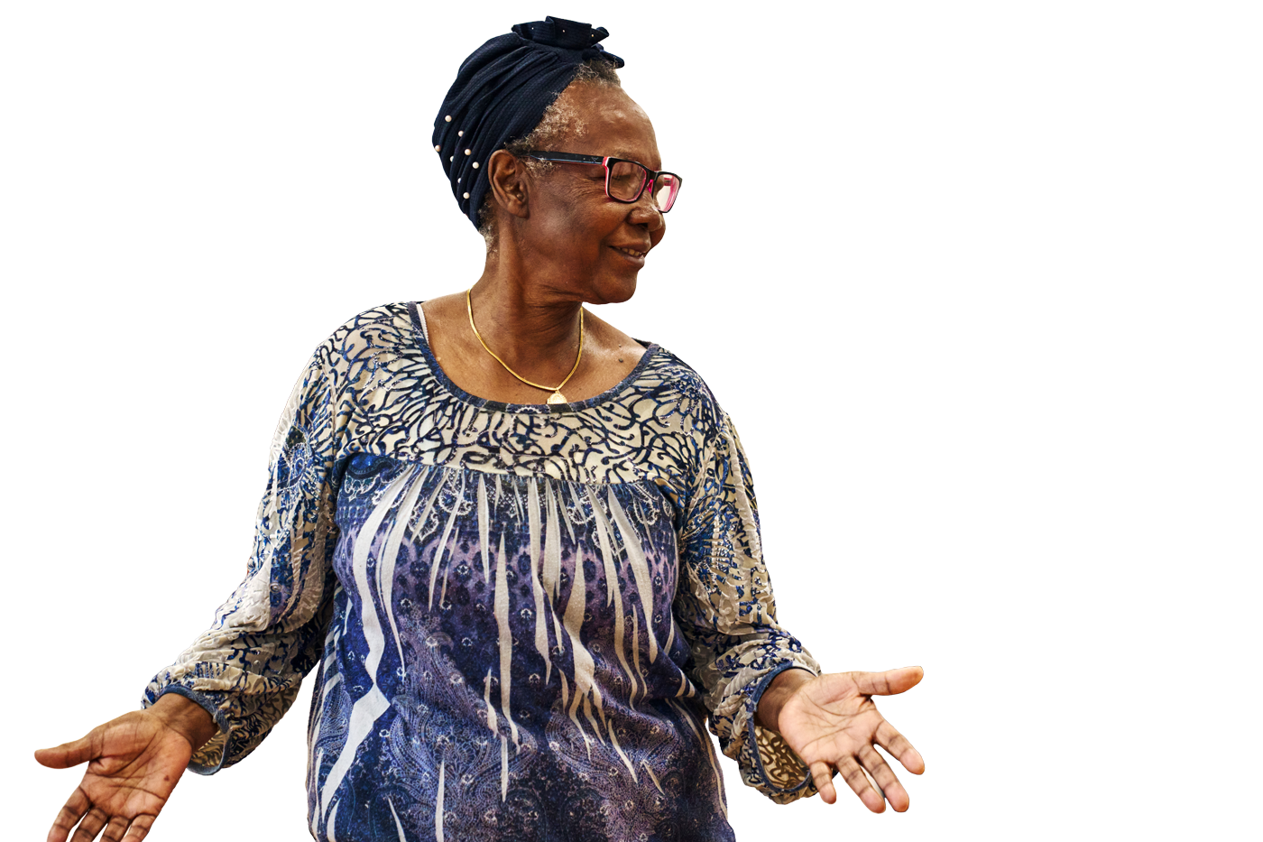 woman with glasses smiling and looking to the side